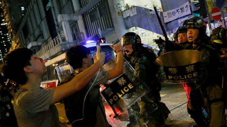 Riot police face off with protesters in Hong Kong, August 11, 2019.