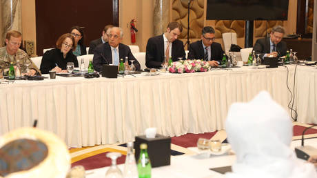 Undated handout picture of US, Taliban and Qatar officials during a meeting for peace talks in Doha, Qatar. © Reuters / Qatari Foreign Ministry
