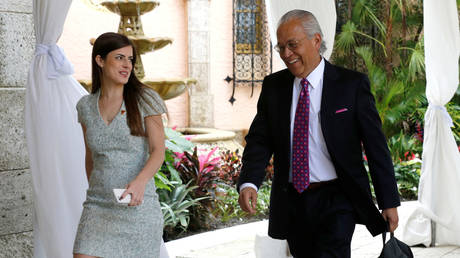 Trump personal assistant Madeleine Westerhout escorts former U.S. Representative Henry Bonilla (R) to meet US President Donald Trump at the Mar-a-lago Club, Florida, U.S. December 30, 2016. © REUTERS/Jonathan Ernst