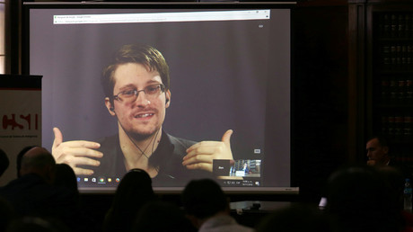 Edward Snowden speaks via video link during a conference at University of Buenos Aires Law School. © Marcos Brindicci