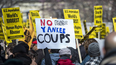 Demonstrators and activists gather to protest against a US led intervention in Venezuela in front of the White House on March 16, 2019.