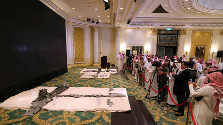 Saudi media members take photos of Houthi drones, brought down April 11 over Jizan and Abha, in Khobar, Saudi Arabia, April 16, 2018. © Reuters / Hamad I Mohammed