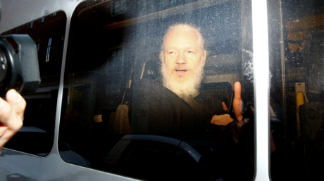 WikiLeaks founder Julian Assange is seen in a police van, after he was arrested by British police, in London, Britain April 11, 2019. © REUTERS/Henry Nicholls