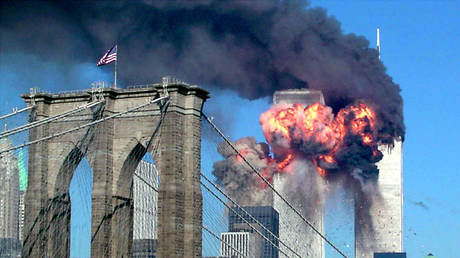 FILE PHOTO: A plane hits the World Trade Center in New York, September 11, 2001 © Reuters / Sara K. Schwittek