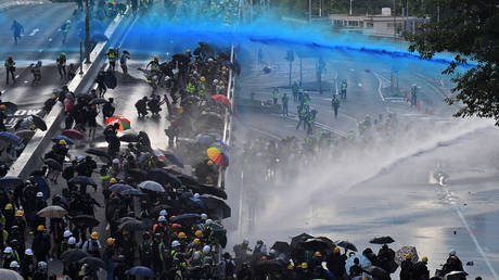 Police use water cannons on protesters outside the government headquarters in Hong Kong, China on September 15, 2019.