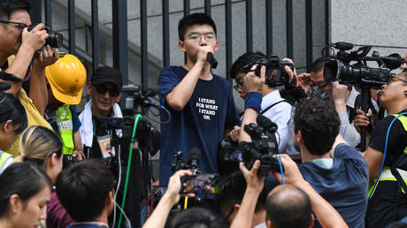 Joshua Wong at a protest outside police headquarters in Hong Kong, June 2019. © Anthony Wallace / AFP