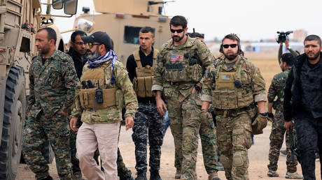 FILE PHOTO: US and Syrian opposition troops patrol near the Turkish border in Hasakah, Syria © Reuters / Rodi Said