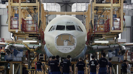 Employees work at the Airbus Tianjin assembly plant in Tianjin municipality, China. File photo