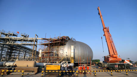Workers are seen at the damaged site of Saudi Aramco oil facility in Abqaiq, Saudi Arabia, September 20, 2019.