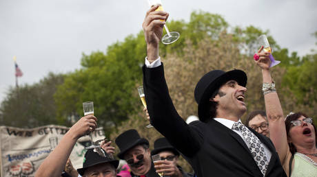 FILE PHOTO: Occupy Wall Street protesters dressed as bankers