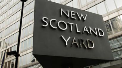 The New Scotland Yard sign stands outside the headquarters of the Metropolitan Police, in central London.(Reuters / Olivia Harris)