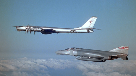 FILE PHOTO: An F4D Phantom fighter of the U.S. Air Force escorting a Tu-95 Bear strategic bomber above the Arctic Ocean © US Navy