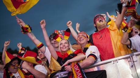 FILE PHOTO: Caption:  Fans at the Brandenburg Gate, Berlin © Global Look Press /  Christian Mang

