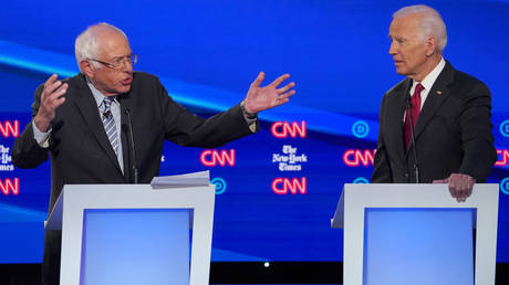 Democratic presidential candidate Senator Bernie Sanders speaks as former Vice President Joe Biden listens during the fourth U.S. Democratic presidential candidates 2020 election debate in Westerville, Ohio, U.S., October 15, 2019. © REUTERS/Shannon Stapleton