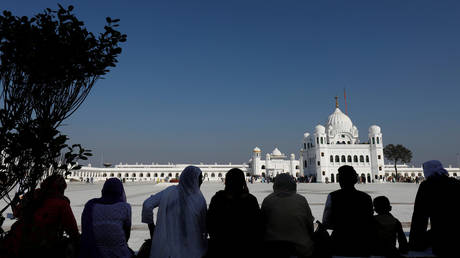 Indian Sikh pilgrims are solhouetted as they visit the Gurdwara Darbar Sahib in Kartarpur, Pakistan November 9, 2019.