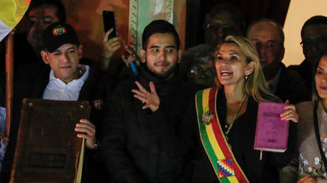 Bolivian Senator Jeanine Anez gestures after she declared herself as Interim President of Bolivia, at the balcony of the Presidential Palace in La Paz, November 12, 2019.