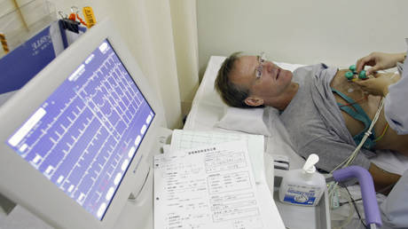 FILE PHOTO: A patient undergoes an electrocardiogram (ECG) test at Juntendo University Hospital in Tokyo, Japan.
