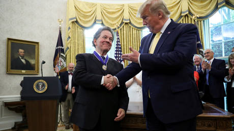 FILE PHOTO: President Donald Trump greets economist Arthur Laffer in the Oval Office of the White House in Washington, DC.