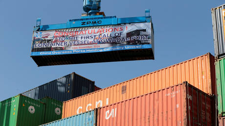 A container is loaded on to the first Chinese cargo ship to depart after the launch of the China Pakistan Economic Corridor port in Gwadar, Pakistan.