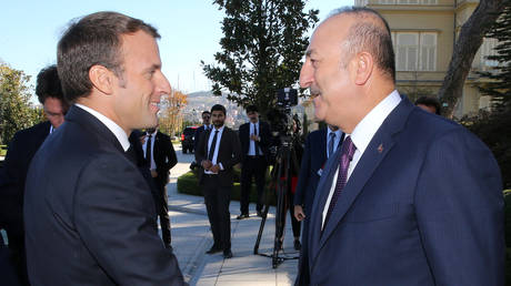 FILE PHOTO: French President Emmanuel Macron and Turkish Foreign Minister Mevlut Cavusoglu
