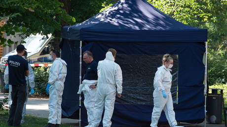 Police and forensic team at a murder scene in Berlin. August 23, 2019. © AFP / dpa / Paul Zinken