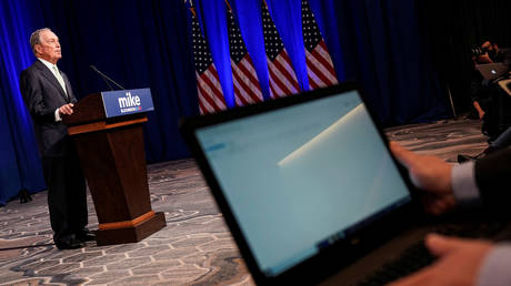 Media cover Democratic US presidential candidate Michael Bloomberg, November 25, 2019.