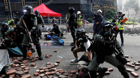 FILE PHOTO: Police detain protesters who attempt to leave the campus of Hong Kong Polytechnic University during clashes with police.