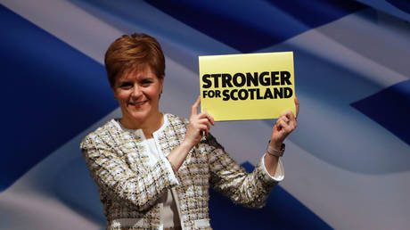 Scotland's First Minister and National Party (SNP) leader Nicola Sturgeon holds up a sign during the party's manifesto launch in Glasgow, Britain, November 27, 2019.