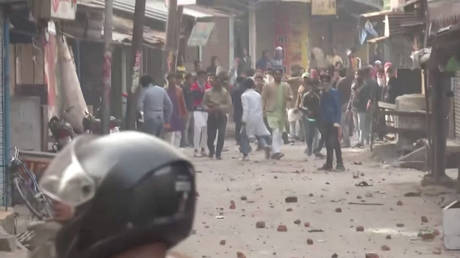 Protesters pelt stones at police personnel during clashes over citizenship law in Gorakhpur, Uttar Pradesh, India December 20, 2019 REUTERS TV / ANI