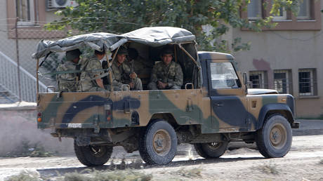 FILE PHOTO Turkish soldiers in a military vehicle patrol near the Akcakale border gate © REUTERS/Murad Sezer