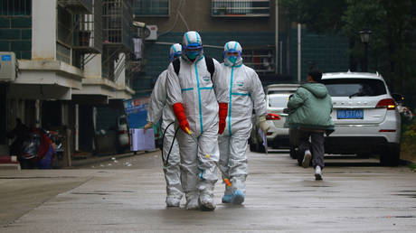 Workers from local disease control and prevention department in Ruichang, Jiangxi Province, China. January 25, 2020. © cnsphoto / Reuters