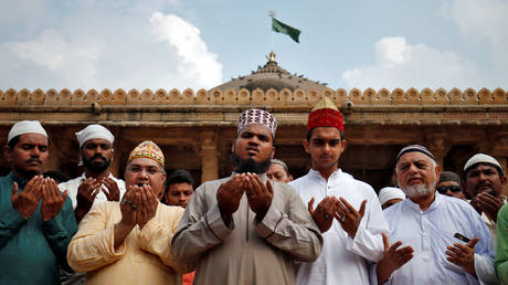 Muslims pray for peace ahead of verdict on a disputed religious site in Ayodhya