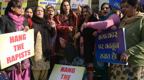FILE PHOTO: A protester holds a noose as others shout slogans during a demonstration following the gang-rape and murder of a student in New Delhi.