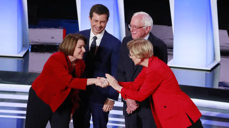 Amy Klobuchar and Elizabeth Warren greet each other at second Democratic presidential debate. Detroit, Michigan