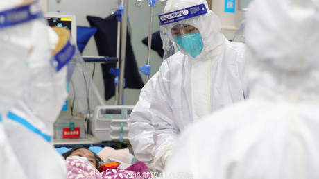 Medical staff attending to a patient, Central Hospital of Wuhan January 25, 2020