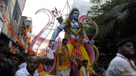 Devotees carry a figure of Lord Rama during a festival in Hyderabad, India. April 2013. © AFP / Noah Seelam