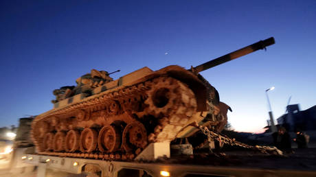 Turkish tanks crossing the border with Syria at Bab al-Hawa, Idlib governorate, February 9, 2020.