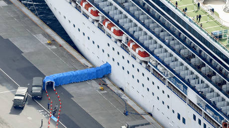 Passengers disembarking from the Diamond Princess cruise ship docked at Yokohama Port