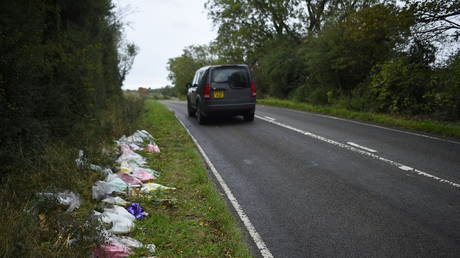 Flowers on the roadside near RAF Croughton where Harry Dunn was killed © Getty Images / Peter Summers