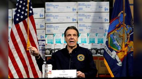 New York Governor Andrew Cuomo speaks in front of stacks of medical protective supplies during a news conference at the Jacob K. Javits Convention Center in New York City, New York, U.S., March 24, 2020. © REUTERS/Mike Segar